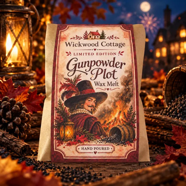 Wickwood Cottage Gunpowder Plot limited-edition 40g hand-poured natural wax melts, featuring vintage Guy Fawkes-inspired packaging with a roaring bonfire, surrounded by glowing lanterns, autumn leaves, pinecones and rustic firewood. Set against a magical moonlit Bonfire Night scene, with sparkling fireworks and warmly illuminated cottages, capturing the rich, smoky cedarwood, soft vanilla and earthy amber fragrance of a cosy November evening.