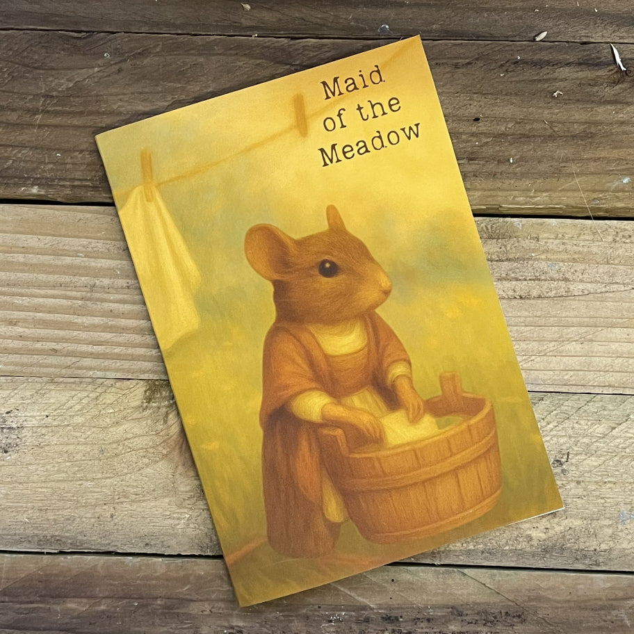 Book cover of 'Maid of the Meadow' with a mouse character holding a basket on a wooden surface.