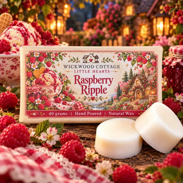Wickwood Cottage Raspberry Ripple 40g hand-poured natural wax melts from the Little Hearts Collection, featuring two chunky ivory wax discs beside beautifully illustrated raspberry-themed packaging, surrounded by juicy red raspberries, a delicious bowl of raspberry ripple ice cream, delicate pink blossoms, homemade raspberry jam and red gingham fabric, all arranged on rustic wood with glowing lanterns and a charming flower-covered cottage in the magical, cosy setting of Honeyburrow Hollow.