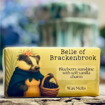 A close-up of the “Belle of Brackenbrook” wax melt packaging featuring a charming illustrated badger and warm cottagecore tones.