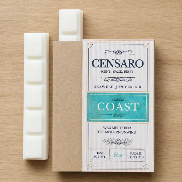 Censaro Coast handmade wax melts with vintage-style packaging and 2 white snap bars on a wooden surface