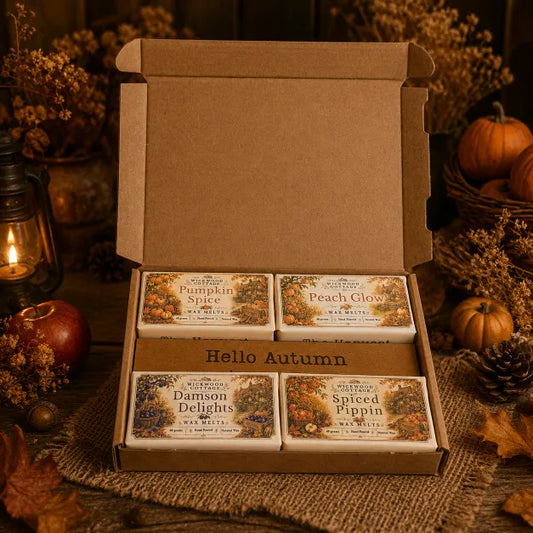 “Wickwood Cottage The Harvest autumn wax melt gift box containing Pumpkin Spice, Peach Glow, Damson Delights and Spiced Pippin, styled with rustic harvest décor.”