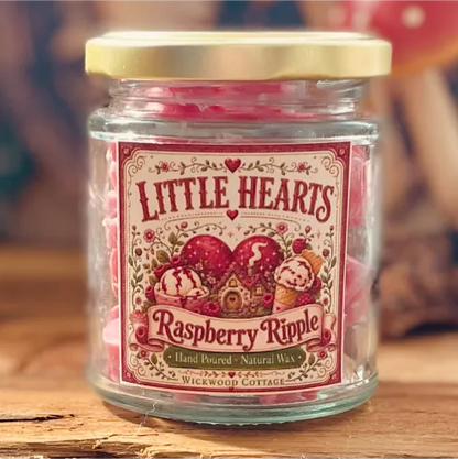 Close-up of a Little Hearts Raspberry Ripple wax melt jar with a whimsical vintage-style label and pink wax melts inside.