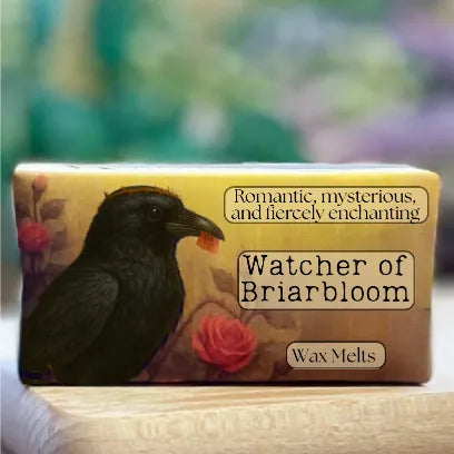 A close-up of the “Watcher of Briarbloom” wax melt packaging with moody, romantic woodland imagery.